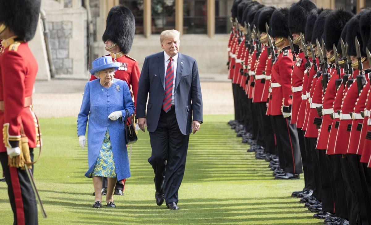 U.S. President Donald Trump and Britain's Queen Elizabeth II inspect a Guard of Honour, formed of the Coldstream Guards at Windsor Castle on July 13, 2018 in Windsor, England. (Richard Pohle/WPA Pool/Getty Images)