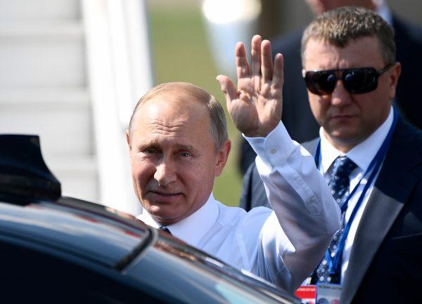 Russian President Vladimir Putin waves upon his arrival at the Helsinki-Vantaa Airport in Helsinki, on July 16, 2018, prior to a meeting between him and U.S. President Donald trump. (JONATHAN NACKSTRAND/AFP/Getty Images)