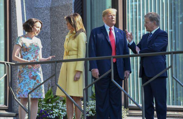 U.S. President Donald Trump (2ndR) and First Lady Melania Trump (2ndL) pose with Finnish President Sauli Niinisto and his wife Jenni Haukio at the Presidential Palace in Helsinki, on July 16, 2018, ahead a meeting between Trump and the Russian president. (BRENDAN SMIALOWSKI/AFP/Getty Images)