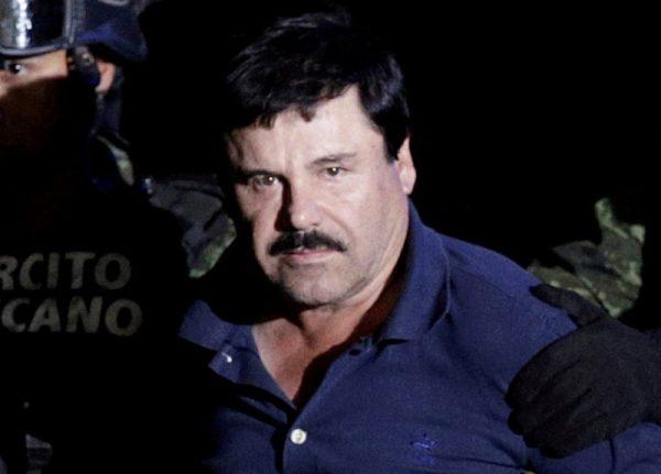 Recaptured drug lord Joaquin "El Chapo" Guzman is escorted by soldiers at the hangar belonging to the office of the Attorney General in Mexico City, Mexico, on Jan. 8, 2016. (Henry Romero/Reuters File Photo)