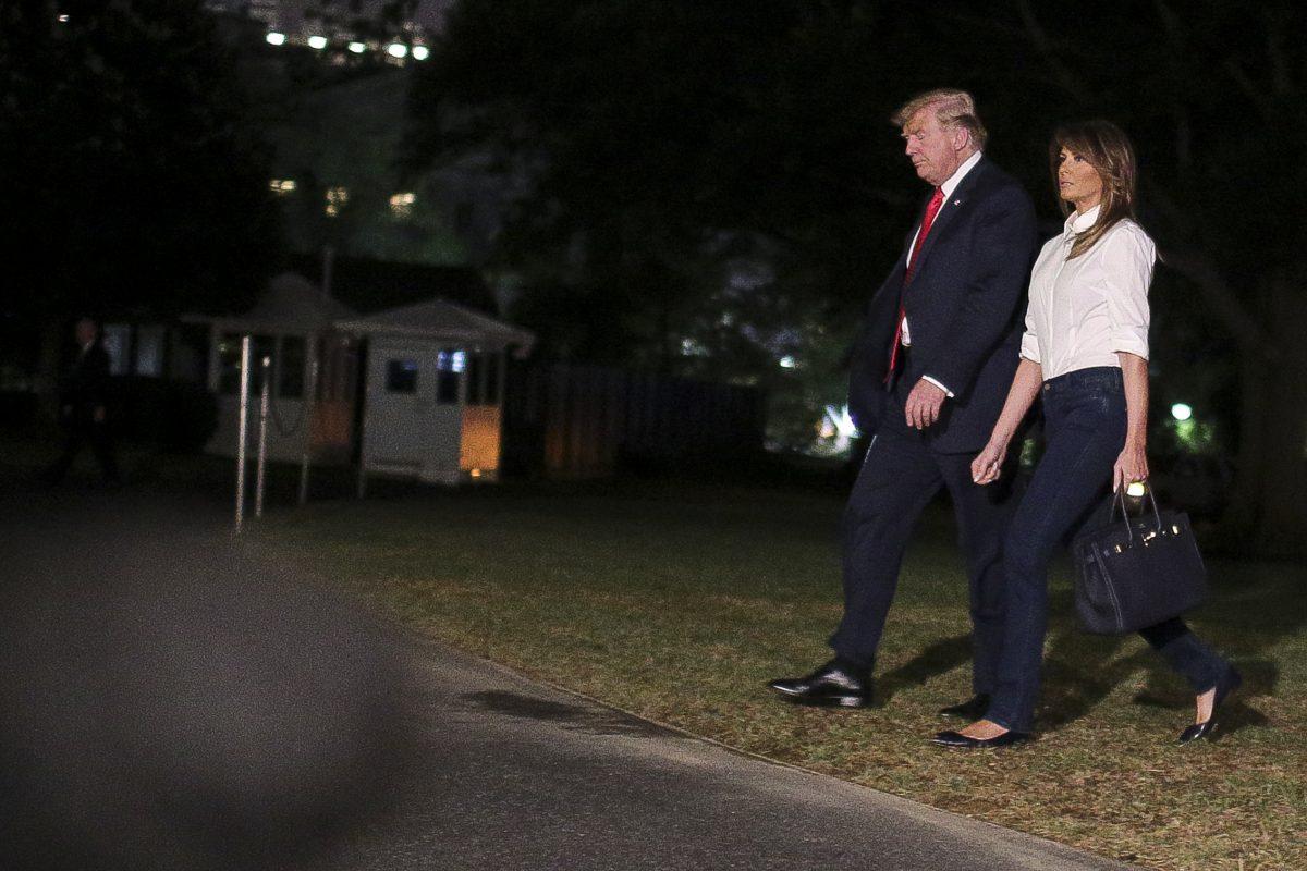 President Donald Trump and First Lady Melania Trump arrive at the White House in Washington on July 16, 2018. (Oliver Contreras-Pool/Getty Images)