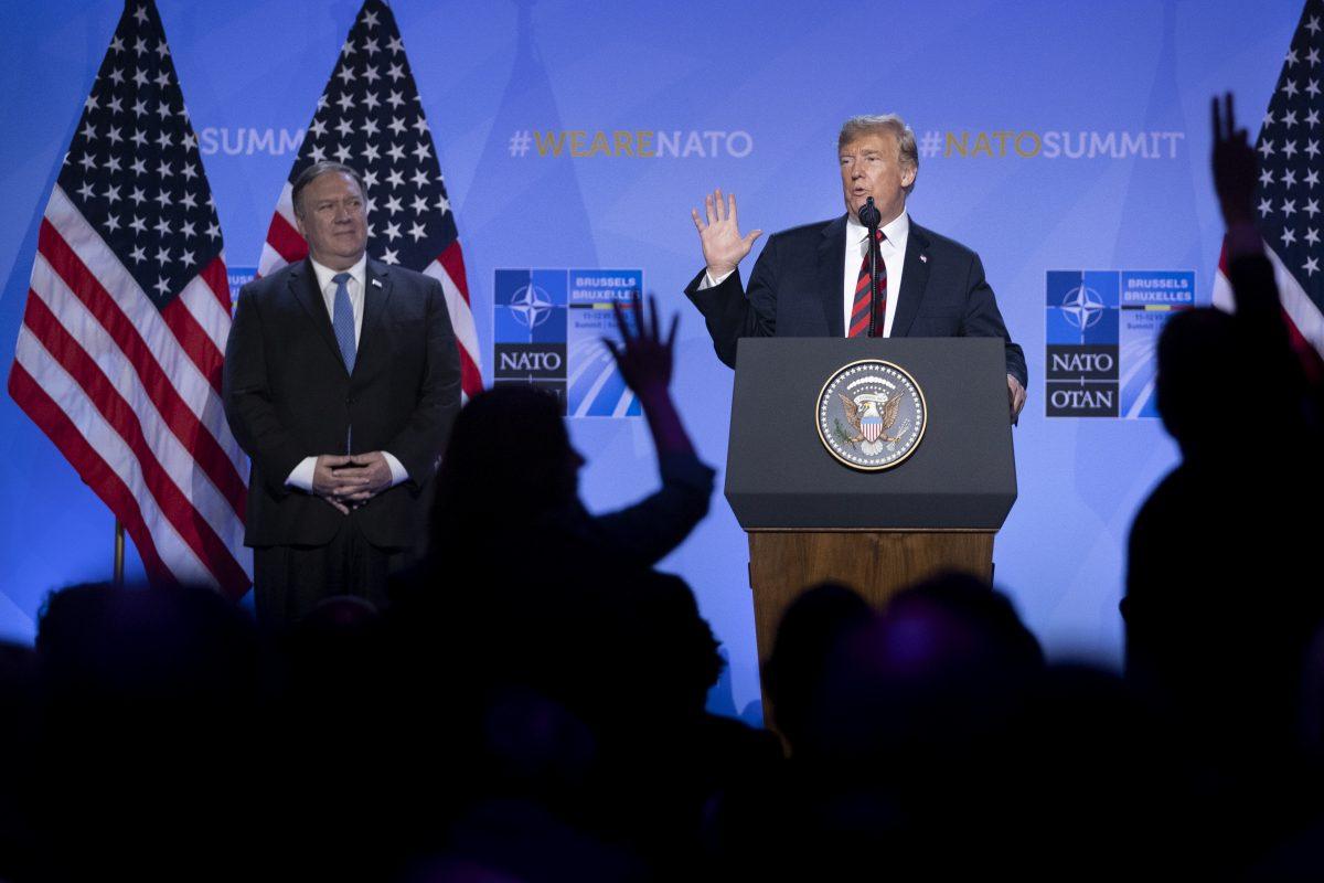 President Donald Trump gestures beside Secretary of State Mike Pompeo during a news conference at the NATO summit in Brussels, on July 12, 2018. (Jasper Juinen/Getty Images)