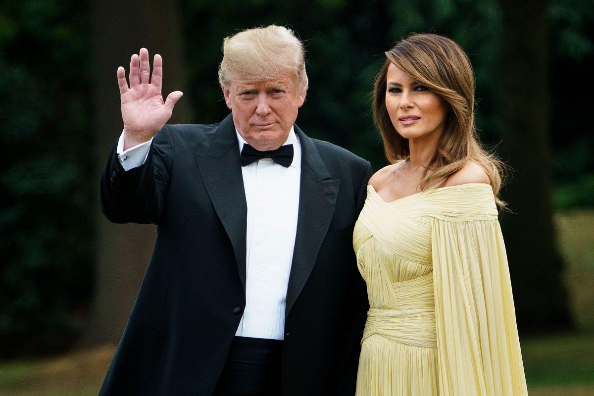 President Donald Trump poses with First Lady Melania Trump as they leave the U.S. ambassador's residence, Winfield House, en route to dinner at Blenheim Palace, west of London, on July 12, 2018. (BRENDAN SMIALOWSKI/AFP/Getty Images)