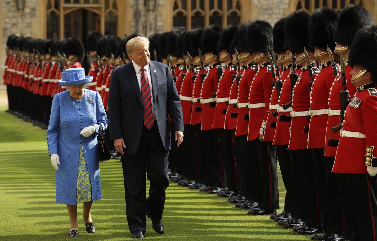 Queen Elizabeth II inspects the Guard of Honour, formed of the Coldstream Guards, with President Donald Trump at Windsor Castle on July 13, 2018. (Matt Dunham–WPA Pool/Getty Images)