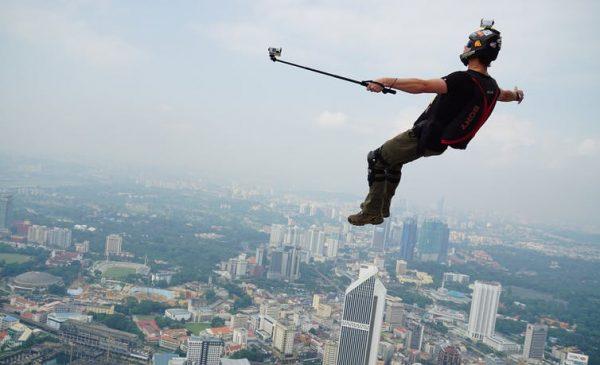A base jumper takes a selfie over a city in this undated photograph. (Shutterstock)