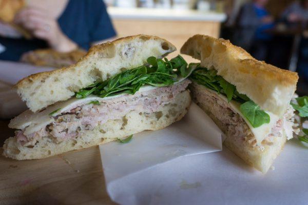 Prato Bakery makes a simple but excellent porchetta sandwich, stuffed with herby, fatty porchetta from an Italian company with a shop in New Jersey—and little else. (Crystal Shi/The Epoch Times)
