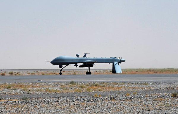 A U.S. Predator unmanned drone armed with a missile stands on the tarmac of Kandahar military airport in Afghanistan on June 13, 2010. (REUTERS/Massoud Hossaini/File Photo)