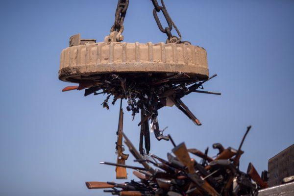 An electromagnet is used to pick up some of the 3,500 confiscated guns to be melted down at Gerdau Steel Mill on July 19, 2018, in Rancho Cucamonga, California. (David McNew/Getty Images)
