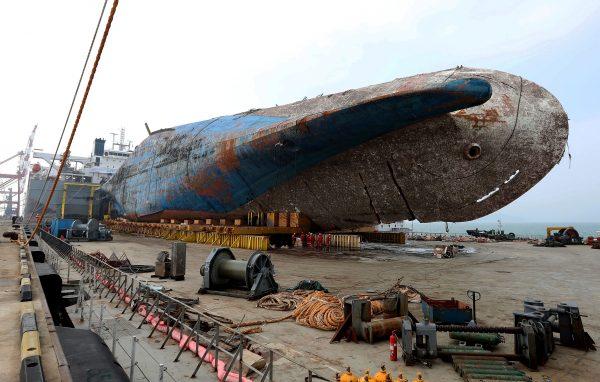 The sunken ferry Sewol sitting on a semi-submersible transport vessel arrived at a port in Mokpo on April 1, 2017 in Mokpo, South Korea. (Photo by South Korean Ministry of Oceans and Fisheries via Getty Images)