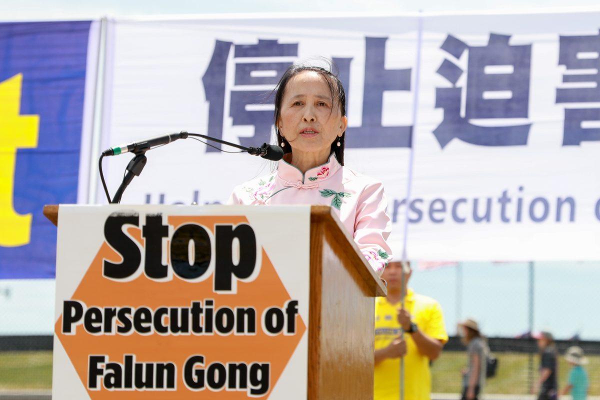 Yi Rong, president of the Global Tuidang Center speaks at the 19th anniversary of the beginning of the persecution of Falun Gong on July 20,1999, at the Washington Monument in Washington on July 19, 2018. (Samira Bouaou/The Epoch Times)
