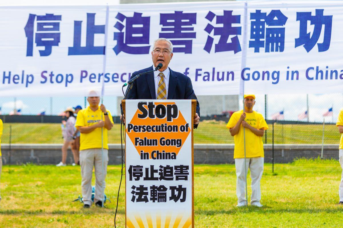 Wang Zhiyuan, chairman of World Organization to Investigate the Persecution of Falun Gong, speaks at a rally calling for an end to the persecution of Falun Gong, in Washington on July 19, 2018 (Mark Zou/Epoch Times)