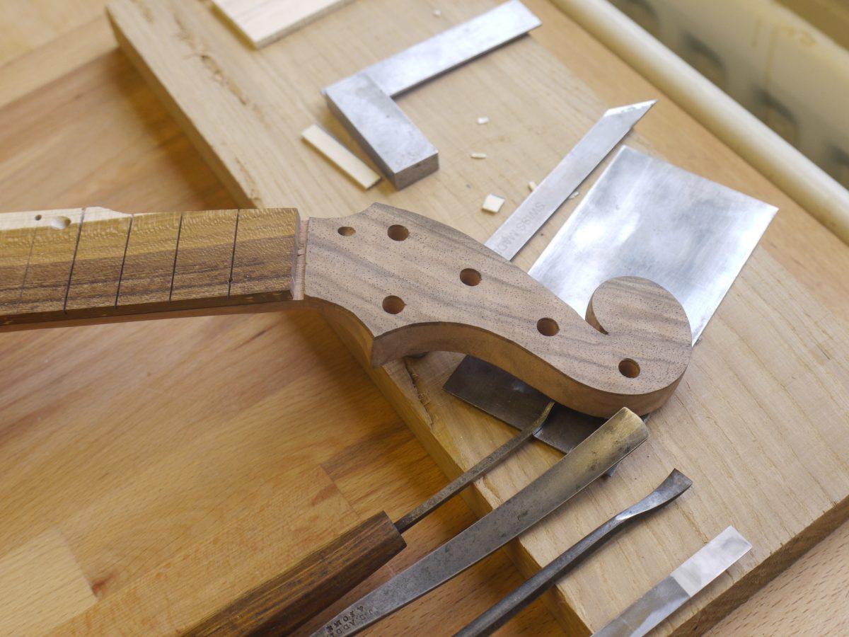 Carving the headstock of a piccolo banjo. (Courtesy of Alex Potter)