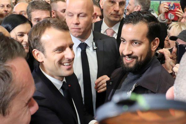 Emmanuel Macron, flanked by Elysee senior security officer Alexandre Benalla (R) at the Porte de Versailles exhibition center in Paris, France, Feb. 24, 2018. (Ludovic Marin/Pool via Reuters)