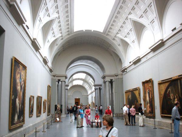 Visitors view artworks at the Prado Museum. (losmininos/Wikimedia Commons)