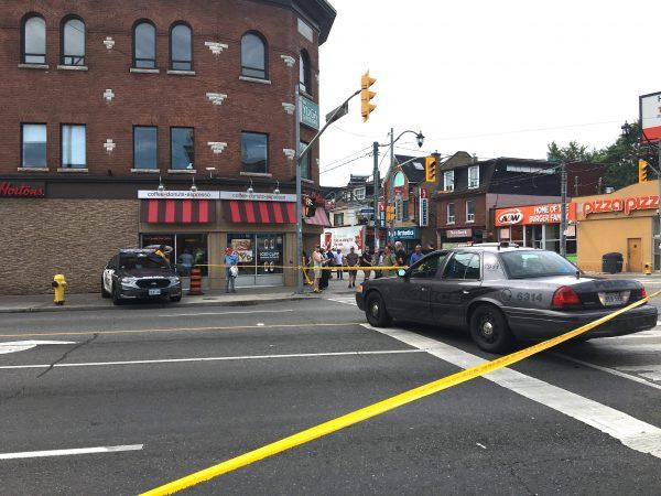 A section of <span class="s1">Danforth Avenue</span> is cordoned off by police in Toronto’s Greektown neighbourhood on July 23, 2018, a day after a mass shooting that left two dead and 12 others injured. (May Ning/The Epoch Times)
