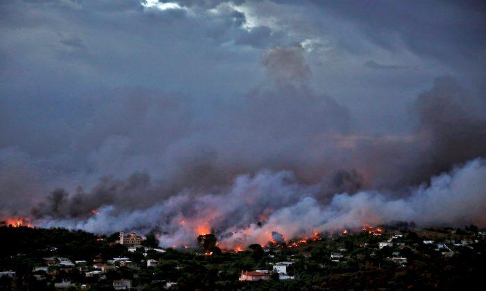 Wildfire Kills at Least 50 Near Athens, Families Flee to Beaches