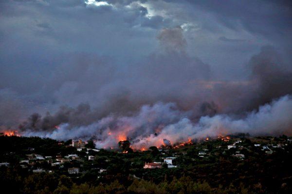A wildfire rages in the town of Rafina, near Athens, Greece, July 23, 2018. (Reuters/Alkis Konstantinidis)