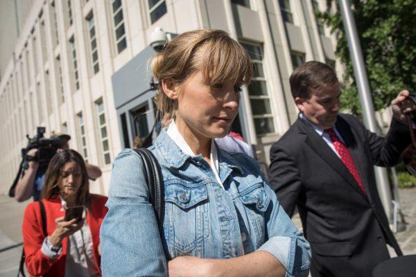 Actress Allison Mack exits the U.S. District Court for the Eastern District of New York following a status conference in the Brooklyn borough of New York City on June 12, 2018. (Drew Angerer/Getty Images)