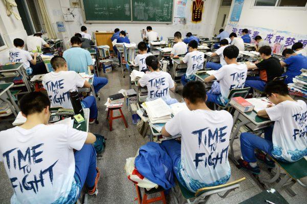 High school students go through exam papers ahead of the annual "gaokao" college entrance exam, in Hebei Province, China, on May 23, 2018. (AFP/Getty Images)