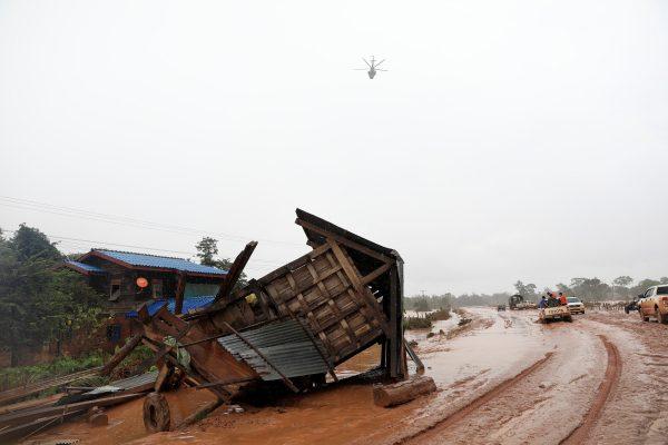 A military helicopter flies during the flood after the Xepian-Xe Nam Noy hydropower dam collapsed in Attapeu province, Laos July 26, 2018. (Reuters/Soe Zeya Tun)