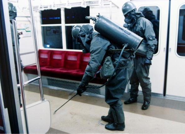 In this handout from the Japanese Defence Agency, personnel of the Self Defence Agency are seen clearing Sarin off platforms after the 1995 Sarin gas attack on Tokyo's subways. (Japanese Defence Agency/Getty Images)