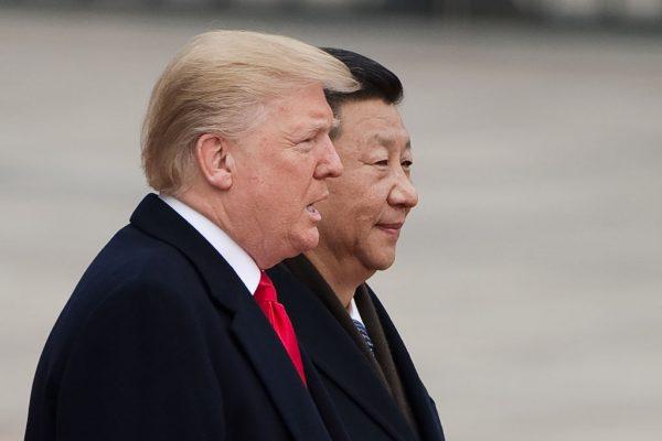 U.S. President Donald Trump and Chinese leader Xi Jinping attend a welcome ceremony at the Great Hall of the People in Beijing on Nov. 9, 2017. (Nicolas Asfouri/AFP/Getty Images)