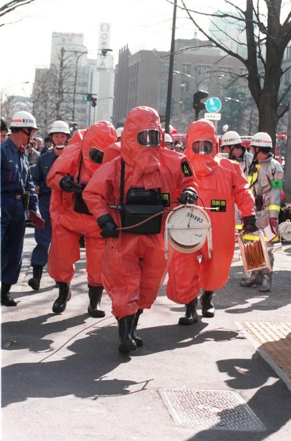 This picture taken on March 20, 1995 shows fire department officers moving into Kasumigaseki subway station following a sarin gas attack by doomsday cult Aum Supreme Truth (Aum Shinrikyo) in Tokyo. (Jiji press/AFP/Getty Images)