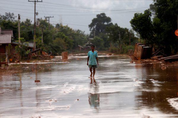 A man walks on a street during the flood after the Xepian-Xe Nam Noy hydropower dam collapsed in Attapeu Province, Laos July 26, 2018. (Reuters/Soe Zeya Tun/Reuters)