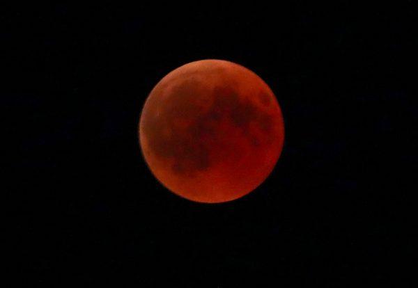 A "blood moon" is seen during a full lunar eclipse in the southern Bavarian village of Raisting, near Munich, Germany on July 27, 2018. (REUTERS/Michael Dalder)