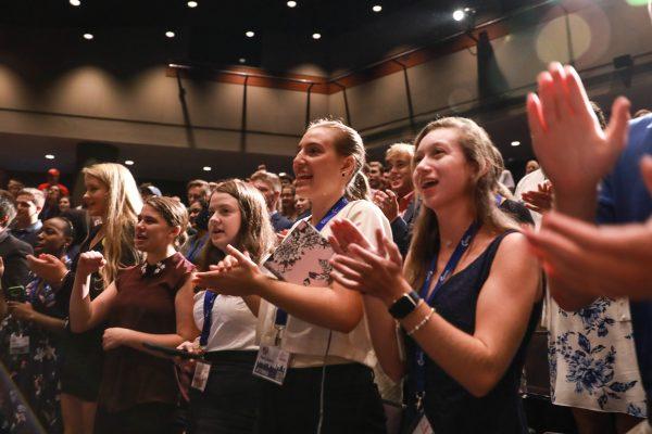 Audience members applaud producer and director Jaco Booyens as he speaks at the High School Leadership Summit, a Turning Point USA event, at George Washington University in Washington on July 26, 2018. (Samira Bouaou/The Epoch Times)