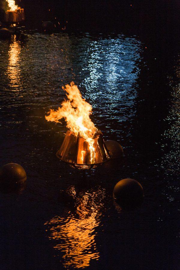 The water borrows light from the fire; the fire is made more beautiful by its reflection in the water. WaterFire is a night of universal binaries—light and dark, fire and water—that complement, not compete with, each other. (Courtesy of Go Providence)