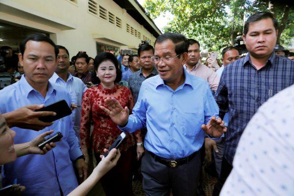 Cambodia's Prime Minister and President of the Cambodian People's Party (CPP) Hun Sen and his wife Bun Rany leave after voting during a general election in Takhmao, Kandal province, Cambodia on July 29, 2018. (REUTERS/Darren Whiteside)