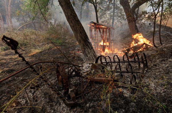A wooden structure burns on the south edge of the Carr Fire near Igo, Calif., on July 29, 2018. (REUTERS/Bob Strong)