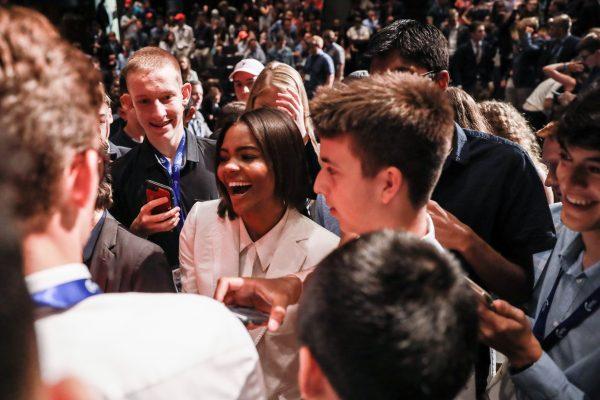 Candace Owens, conservative commentator and activist, is mobbed by teenage fans after speaking at Turning Point USA's High School Leadership Summit at George Washington University in Washington on July 26, 2018. (Samira Bouaou/The Epoch Times)