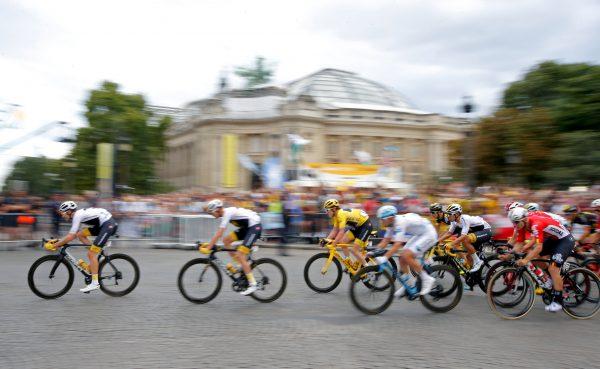 Team Sky rider Geraint Thomas of Britain, wearing the overall leader's yellow jersey, in the peloton. (Reuters/Stephane Mahe)
