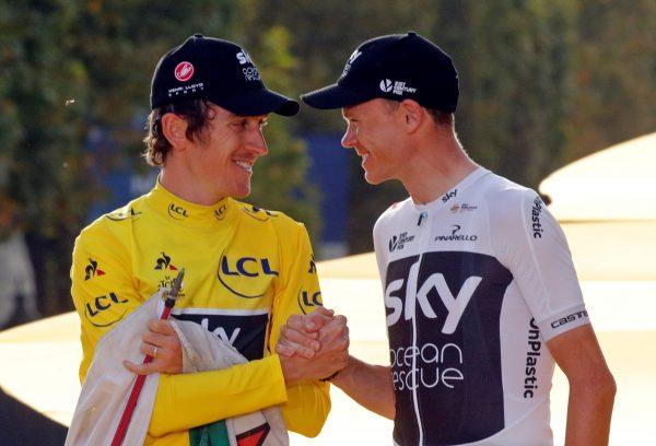 Team Sky rider Geraint Thomas of Britain, wearing the overall leader's yellow jersey, and teammate Chris Froome of Britain celebrate on the podium. (Reuters/Philippe Wojazer)