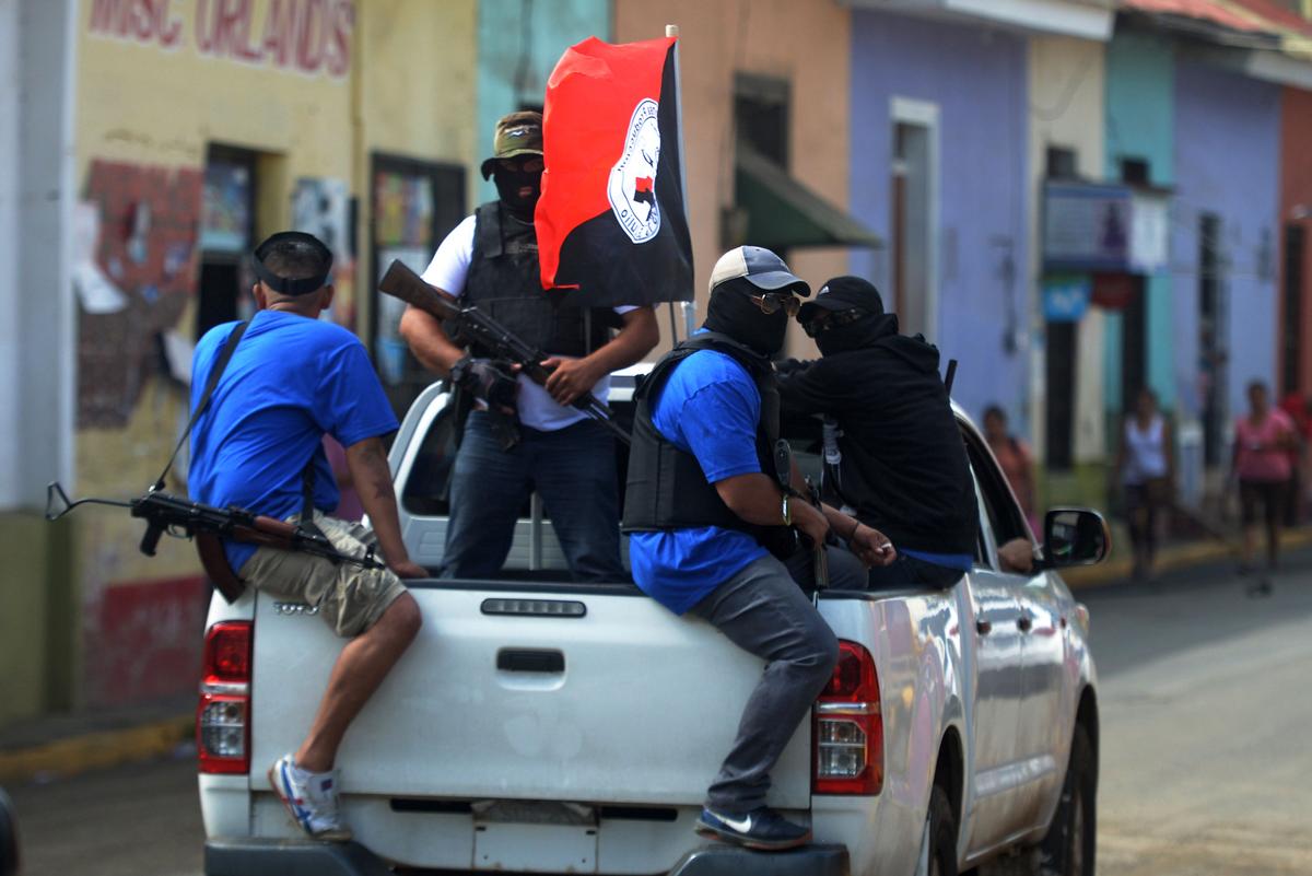 Paramilitaries on a truck at the Monimbo neighborhood in Masaya, Nicaragua, on July 18, 2018, following clashes with anti-government demonstrators. (Marvin Recinos/AFP/Getty Images)