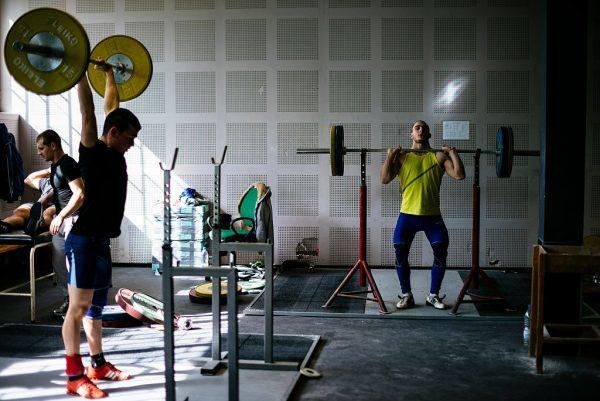 Athletes lift weights during a training session at the Bulgaria's national weightlifting centre in Sofia on March 26, 2016. (Dimitar Dilkoff/AFP/Getty Images)