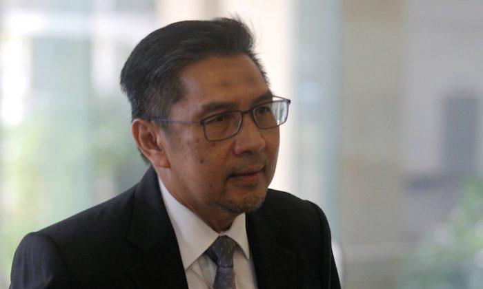 Malaysia Civil Aviation Chief Resigns Over MH370 Lapses