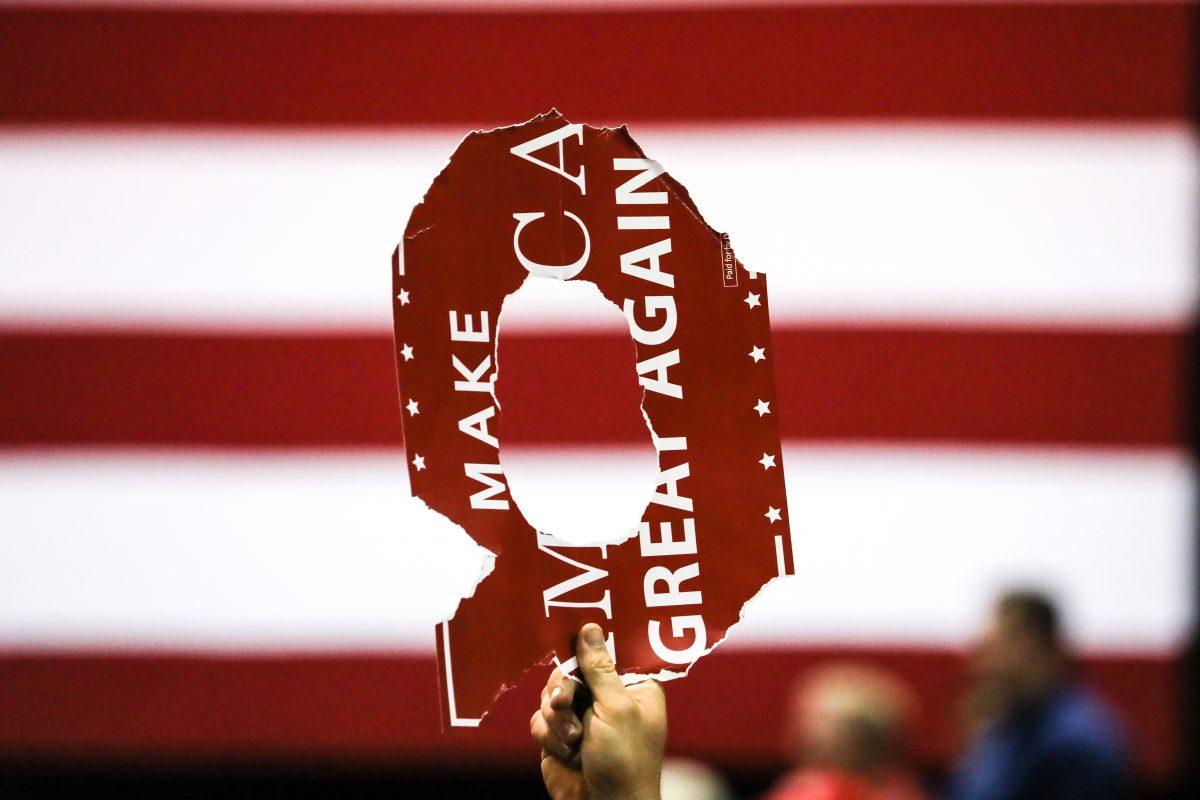An audience member holds up a sign during President Donald Trump's Make America Great Again rally in Tampa, Fla., on July 31, 2018. (Charlotte Cuthbertson/The Epoch Times)