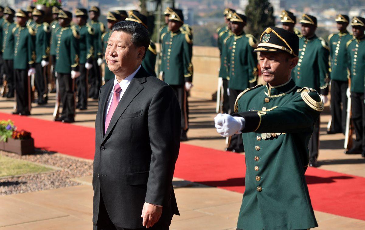  Chinese leader Xi Jinping inspects a military honor guard during his official state visit at the Union Building in Pretoria, South Africa, on July 24, 2018. (Phill Magakoe/AFP/Getty Images)
