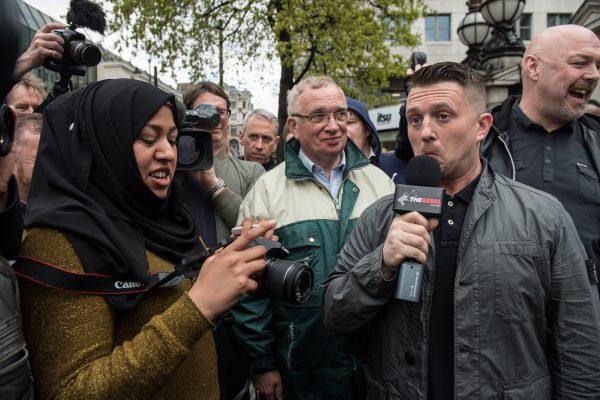 Tommy Robinson speaks to a Muslim woman during a protest titled 'London march against terrorism' in response to the March 22 Westminster terror attack on April 1, 2017 in London, England. (Chris J Ratcliffe/Getty Images)