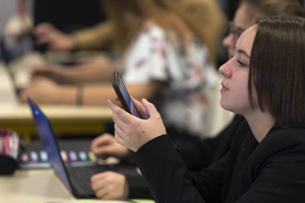 French high school students use smartphones and tablet computers at the vocational school in Bischwiller, eastern France. (Patrick Hertzog/AFP/Getty Images)