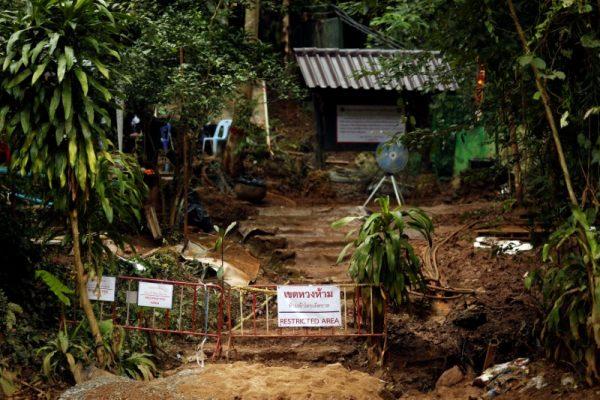 A "Restricted Area" sign is seen in front of the Tham Luang cave complex, after the rescue mission for the 12 boys of the "Wild Boars" soccer team and their coach, in the northern province of Chiang Rai, Thailand July 14, 2018. (Reuters/Tyrone Siu/File Photo)