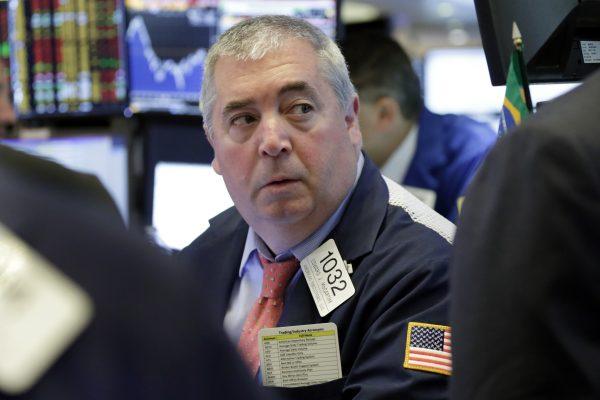 Trader Edward McCarthy work on the floor of the New York Stock Exchange on Aug. 2, 2018. (AP Photo/Richard Drew)