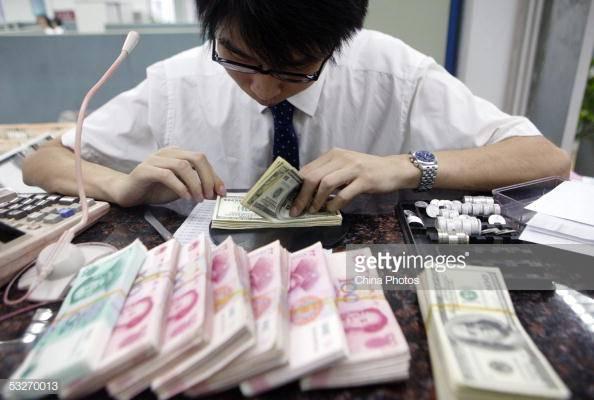 Chinese Get Creative to Send Money Overseas as Yuan Depreciates