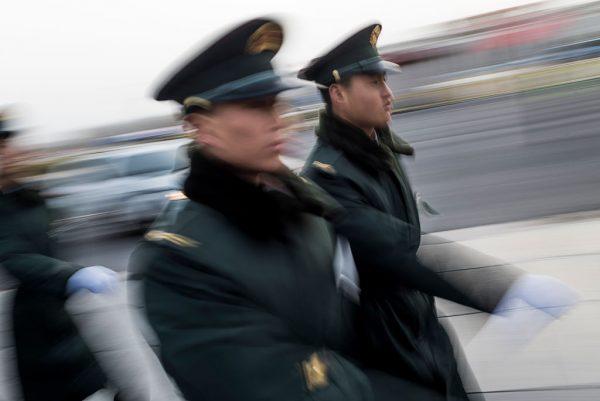 Chinese paramilitary guards walk outside outside the Great Hall of the People on March 5, 2016. (Fred Dufour/AFP/Getty Images)