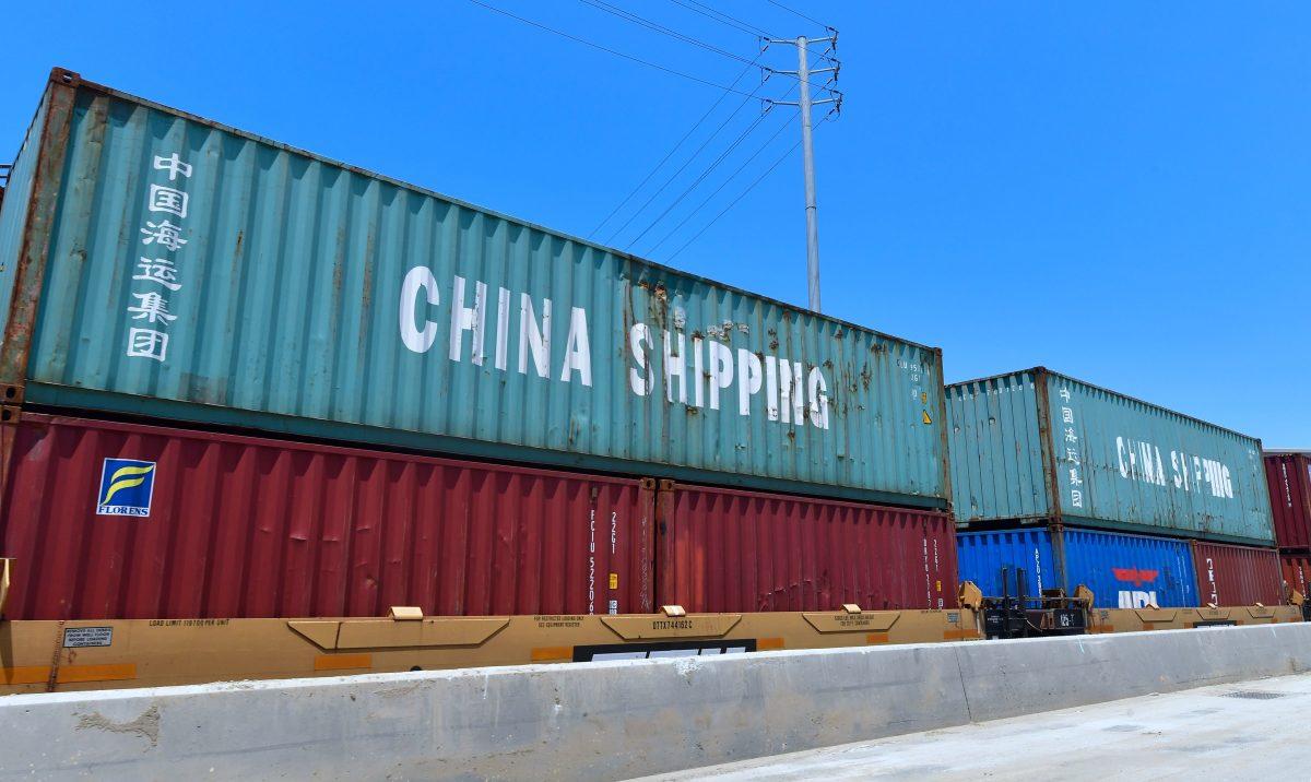 Shipping containers, including those of China Shipping, a shipping conglomerate under the direct administration of China’a State Council, await transportation on a rail line at the Port of Long Beach in Long Beach, Calif., on July 12, 2018. (Frederic Brown/AFP/Getty Images)