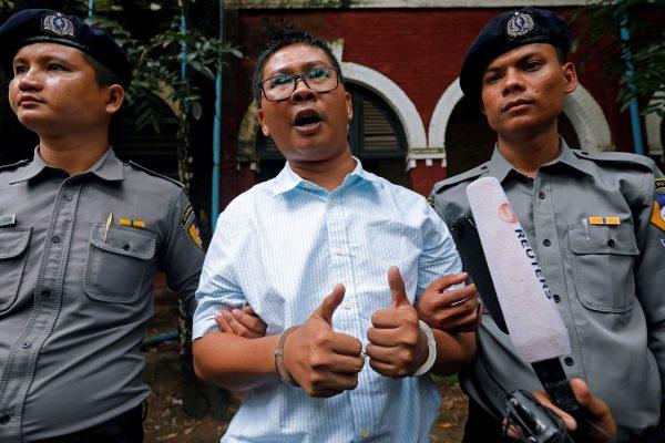 Detained Reuters journalist Wa Lone speaks to the media as he leaves Insein court in Yangon, Myanmar July 30, 2018. (Reuters/Stringer)