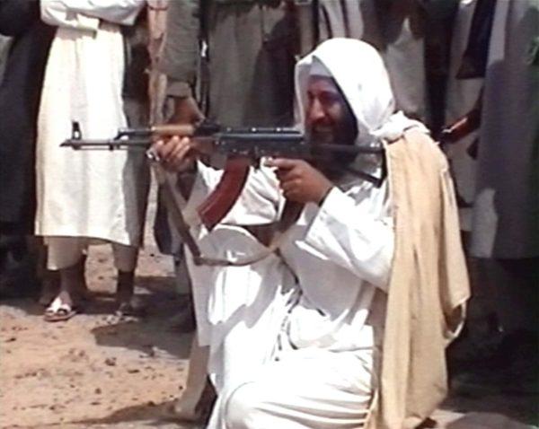 Saudi-born Osama bin Laden is seen aiming a weapon in this undated photo from Al-Jazeera TV. (Photo by Al-Jazeera/Getty Images)